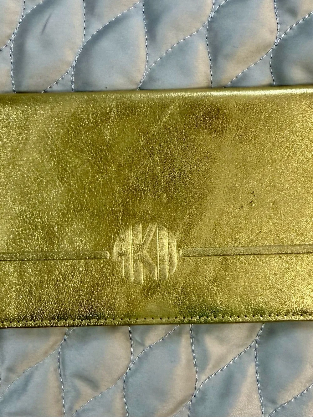 Metallic Gold Phone Wallet Case with Embossed Monogram Detail